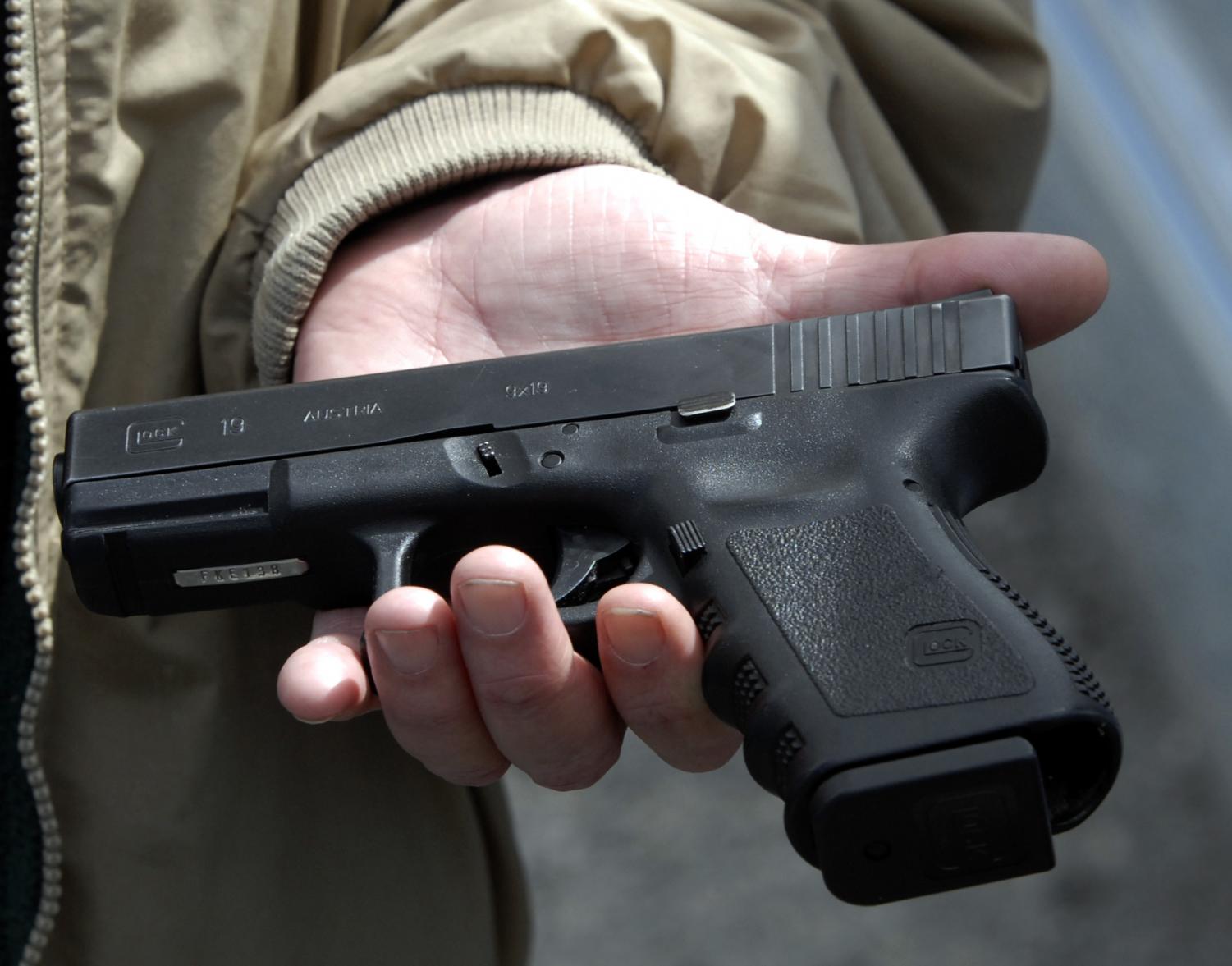 Firearms owner John Markell holds a Glock 9 mm pistol in Roanoke, Va., in this April file photo. The gun is similar to one sold to Seung-Hui Cho, the Virginia Tech shooter. Congress on Wednesday passed a long-stalled bill inspired by the Virginia Tech shootings that would more easily flag prospective gun buyers who have documented mental health problems. (AP Photo)