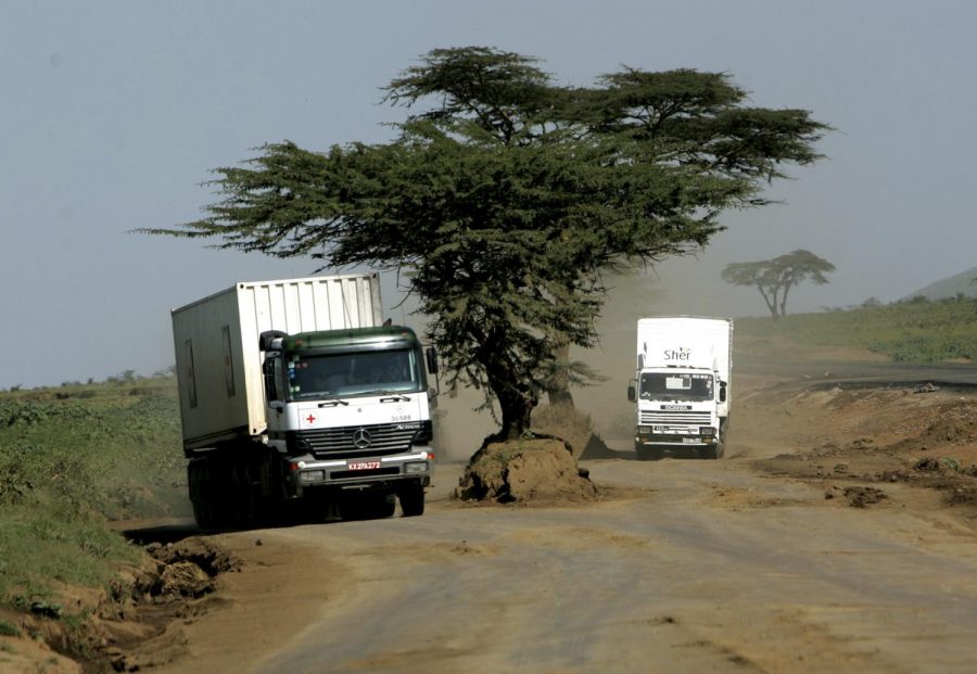 A Red Cross truck travels on a dirt road, Monday, Feb. 12, 2007, outside the Kenyan town of Naivasha. Tens of thousands of trucks every year carry food, fuel and other goods to 100 million people in east and central Africa up a bone-jarring, dilapidated two-lane road.