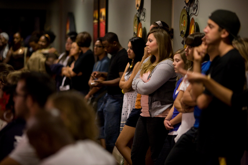 Seats at the Poetry Lounge Thursday night filled up quickly, leaving students to line up against the back walls of the banquet room.  Photo by Mike Villa