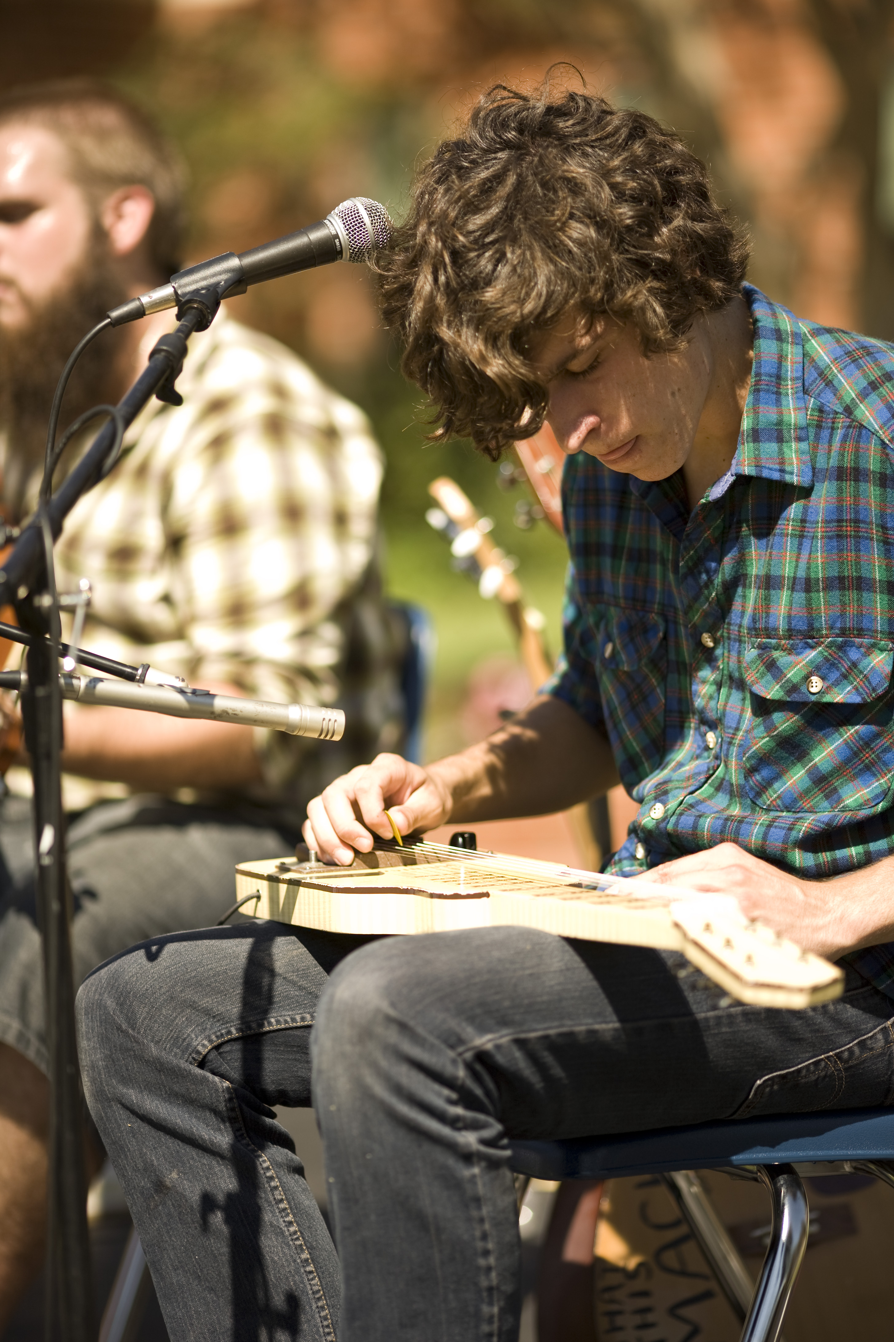 Joel Hasemeyer, sophomore, played alongside Matt Winter during the AS BBQ lunch event to provide the musical entertainment.   Photo by Mike Villa