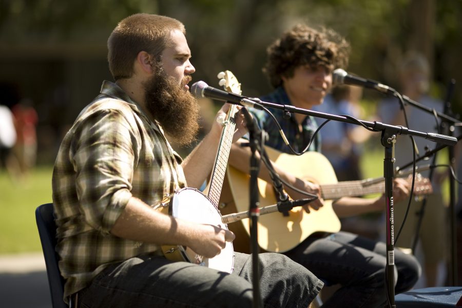 Matt Winter and Joel Hasemeyer, sophomore, played on their banjo and guitar throughout the event to add to the western atmosphere of the AS BBQ lunch.   Photo by Mike Villa