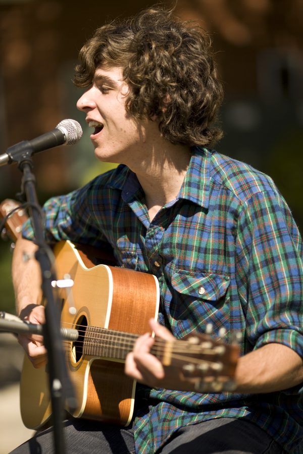 Joel Hasemeyer, sophomore, played his guitar throughout the AS BBQ lunch as part of the musical guest of the event.   Photo by Mike Villa