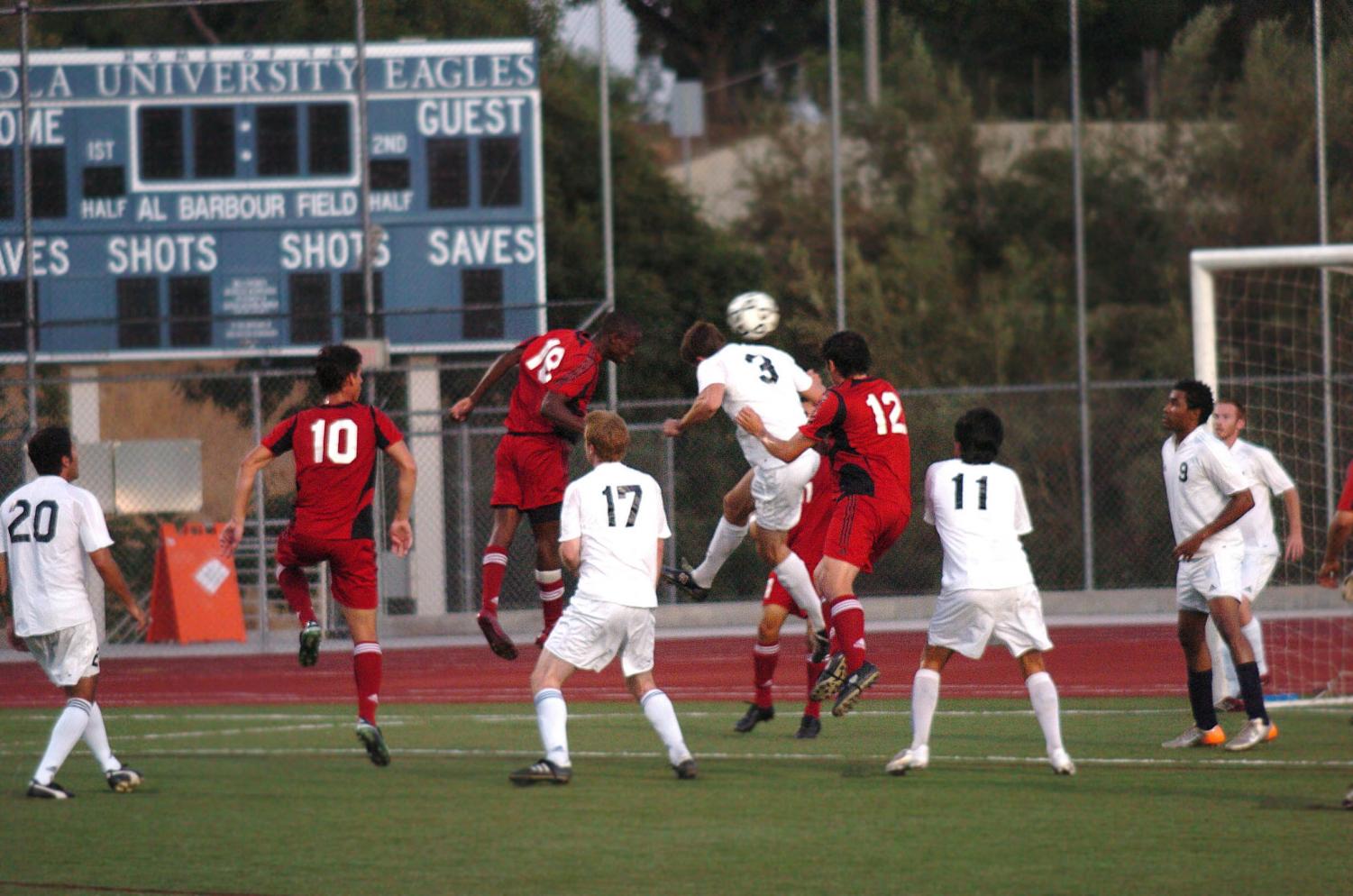 The Biola men's soccer team (in red) played the Biola alumni soccer team (in white). The alumni pulled out a win with a two goal lead over the Biola Eagles.