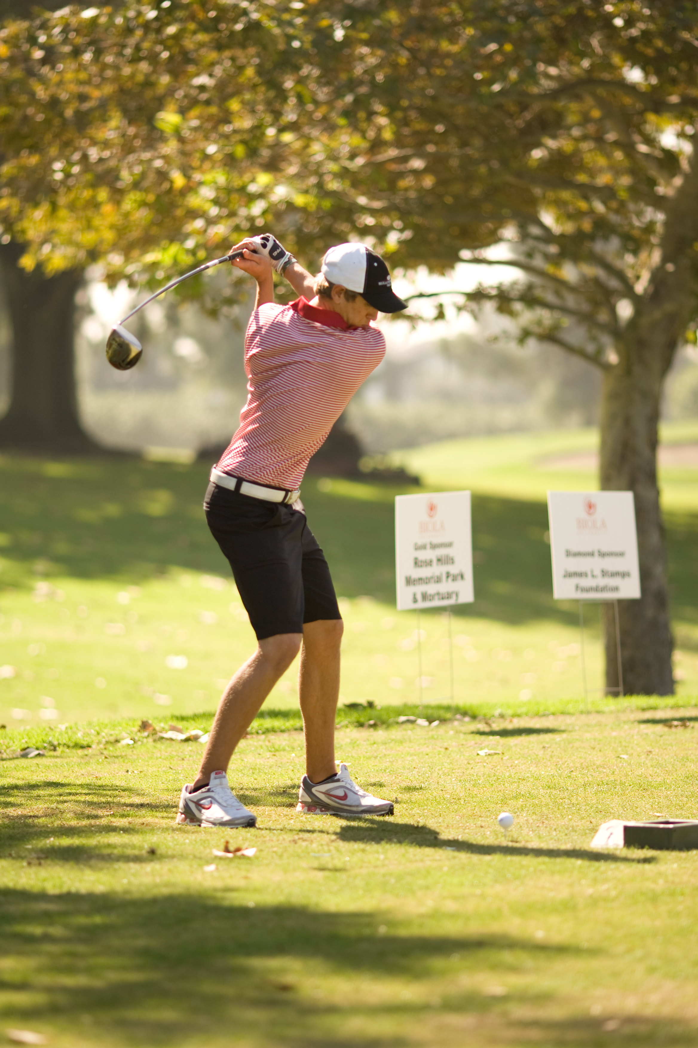 Freshman Jon Enge, a member of the golf team, drives a golf ball at Biola’s annual golf tournament at Los Coyotes Country Club on Monday. Funds raised from the tournament benefit scholarships for Biola’s athletics programs. Photo by Mike Villa