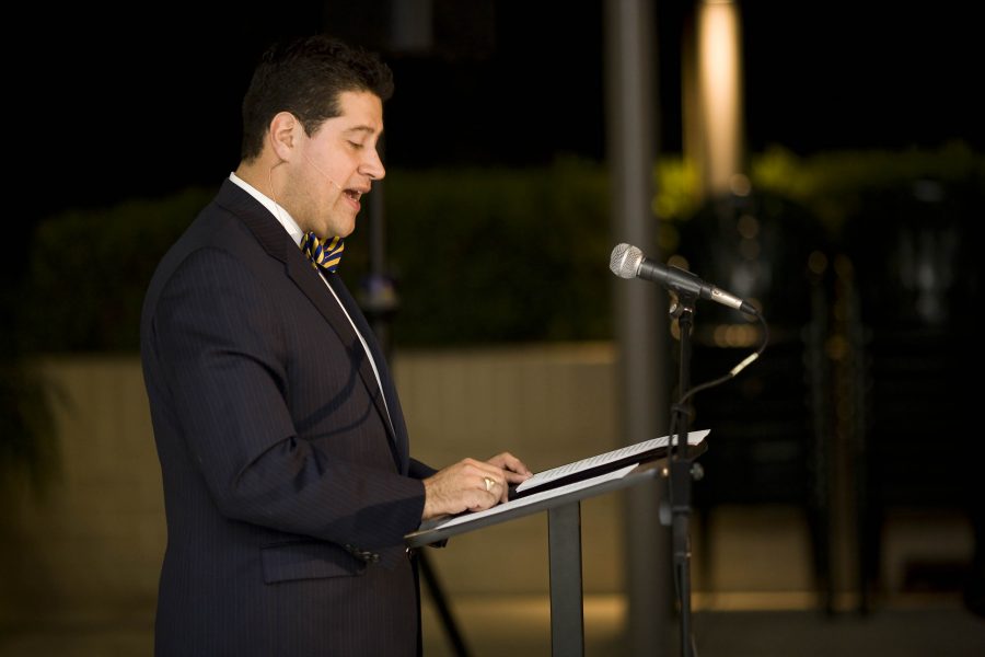 Regent Universitys chair of government Gerson Moreno-Riano lectures about faith and politics in the library courtyard Tuesday night.   Photo by Mike Villa