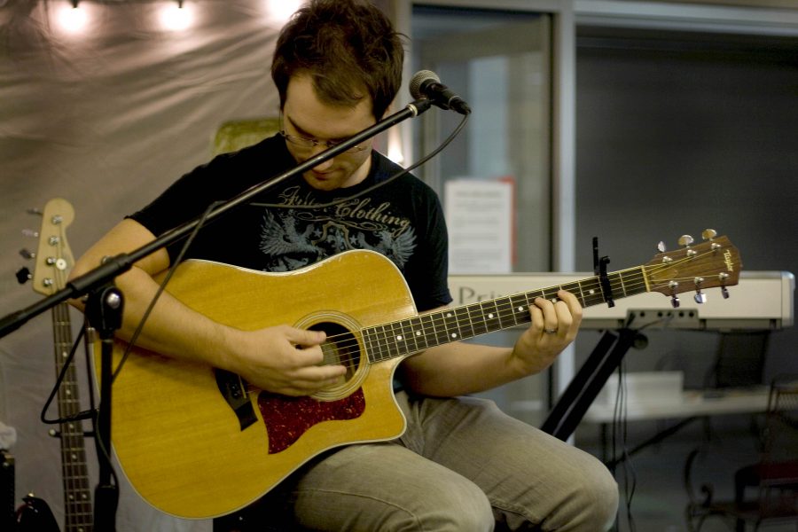 Jason Smart, started off the night, playing his music as guests entered into Stewart Lobby.  Photo by Bethany Cissel