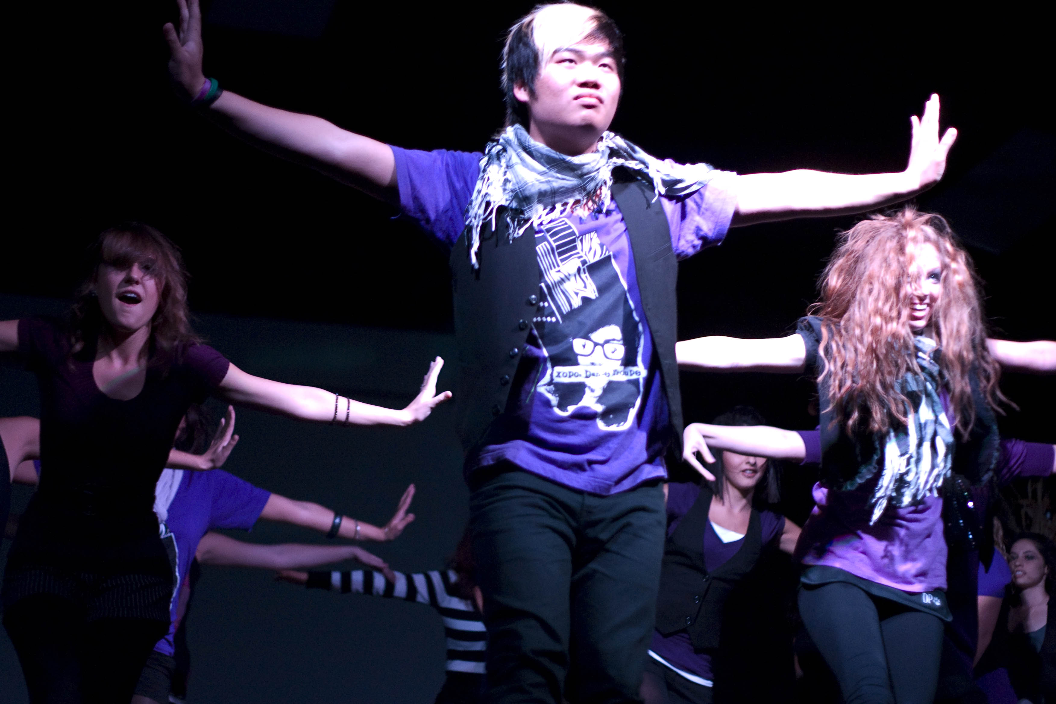 Director and choreographer of Xopoc dance troupe Marshall Bang takes center stage during the dance performance.  Photo by Bethany Cissel