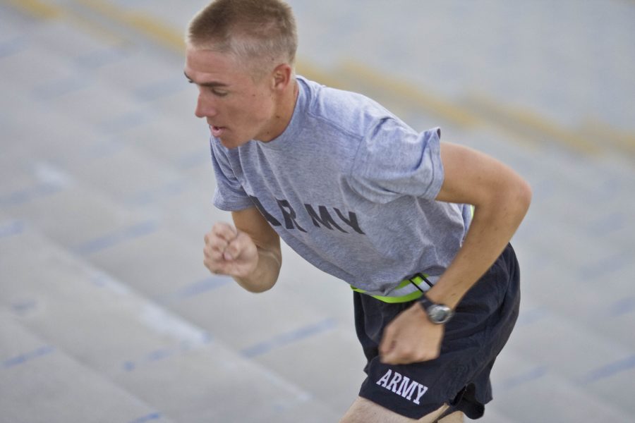 Nick Griepsma, a Biola junior and ROTC PT instructor, begins his early morning training on the stadium bleachers at Cal. State Fullerton.  Photo by Kelsey Heng