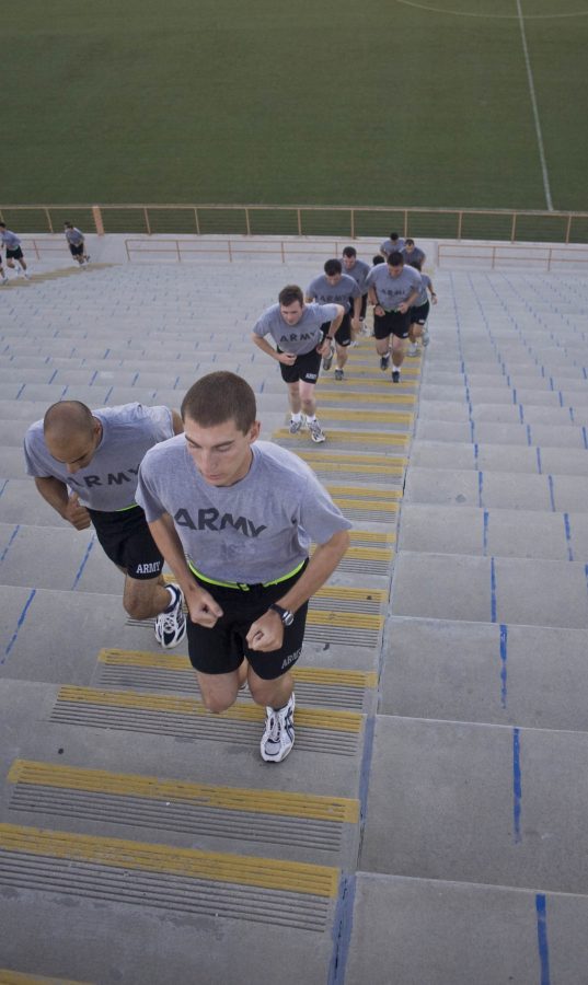 One of four groups of PT trainees face the stadiums stair workout and encouraging each other along the way.   Photo by Kelsey Heng