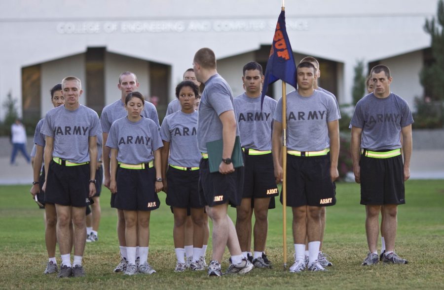 A selection of students stand at attention formation after their physical training.   Photo by Kelsey Heng
