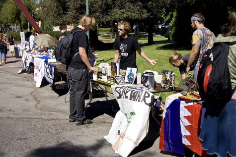 Student clubs set up tables along the campus walkway in hope of recruiting new members.   