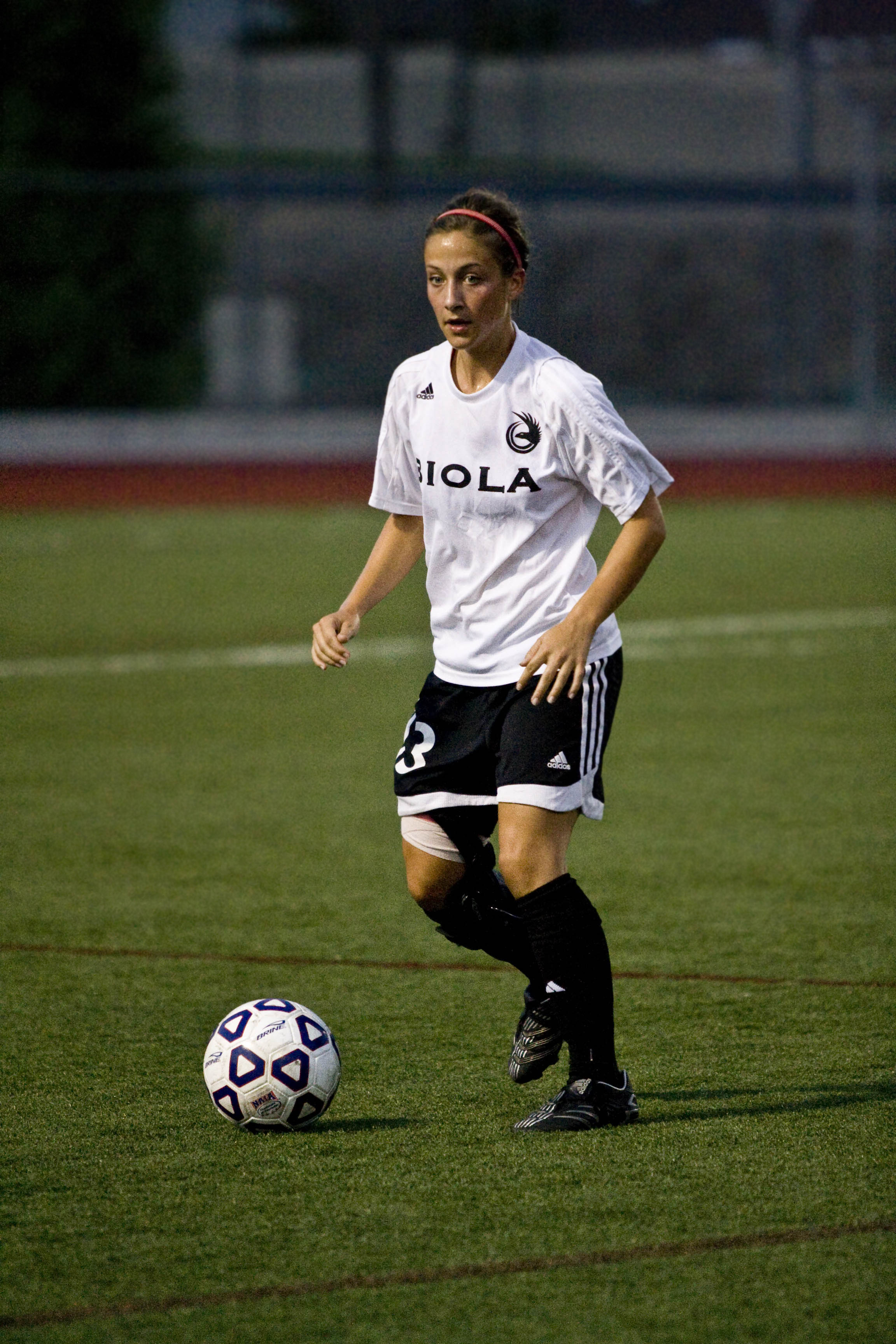 Nikki Mathis, Junior, sets up for a pass to her teammate.  The women's soccer team faced a 3-0 defeat in their first GSAC game against The Master's College. Photo by Kelsey Heng