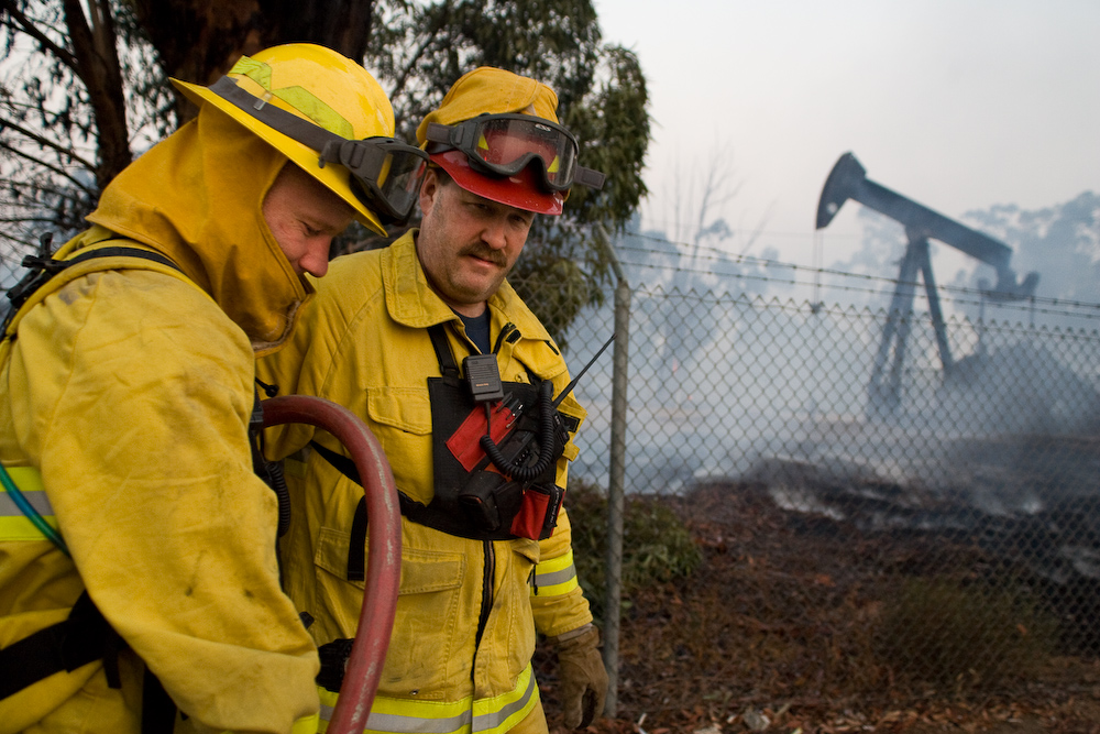 Fire Captain Dustyn Wiggins instructs his crew to pack up and move from their location on Rose Drive, just outside of Carbon Canyon to the next site. Photo by Mike Villa