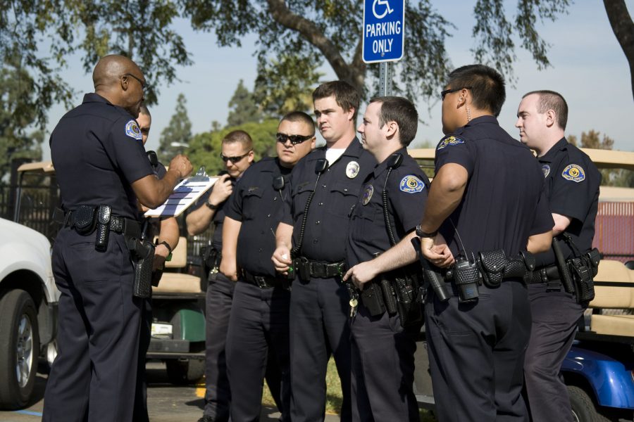 John Ojeisekhoba, deputy chief, gives his officers assignments in preparation for the campus-wide Great Southern California ShakeOut, the nation’s largest earthquake drill. Photo by Bethany Cissel