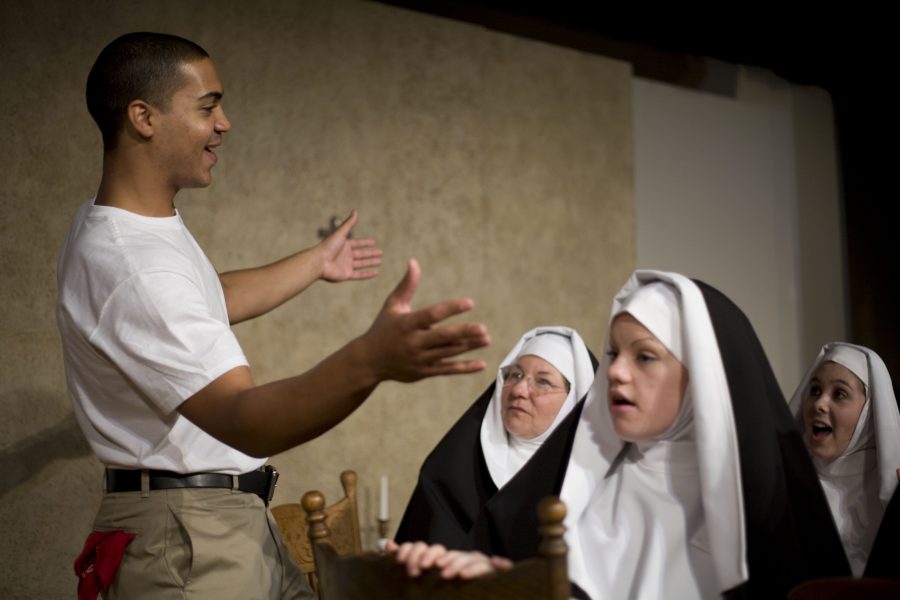 Sean Rowry plays Homer Smith in “Lilies of the Field,” the fall play from Biola University’s speech / drama department. Susan Gaines, freshman Kerri Klingsmith and junior Missy Walker play nuns in the performance. Photo by Mike Villa