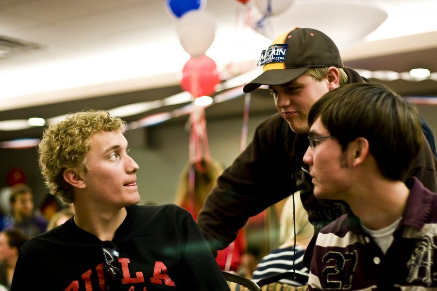 Taylor Horky, freshman, Steven Moulton, sophomore, and Ethan Stupfel, freshman, discuss their predictions of the soon to be announced president at the Biola College Republican event in the Caf Banquet Room.   Photo by Christina Schantz