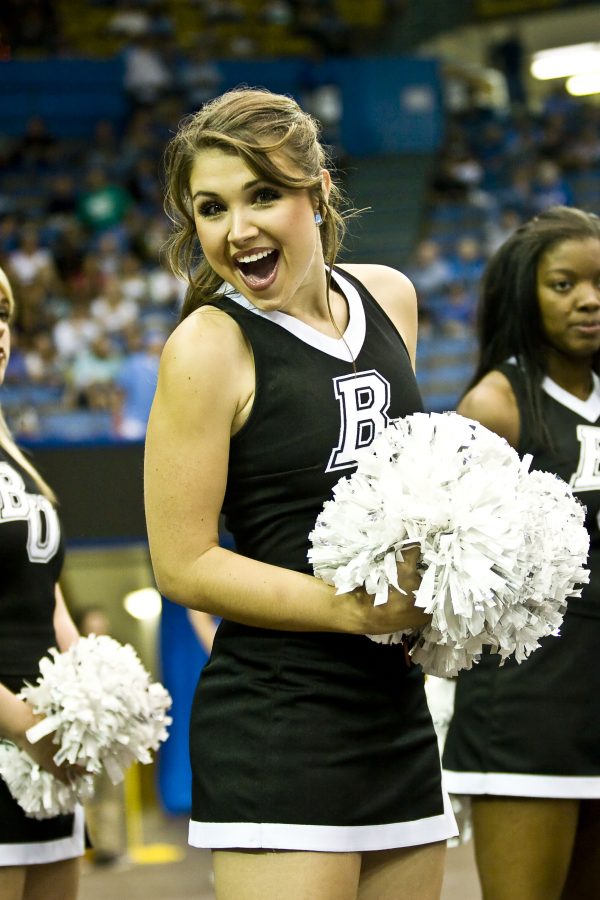 Courtney Cheatam, junior, cheered alongside the Biola Cheer Squad in the mens basketball game against UCLA.   Photo by Christina Schantz