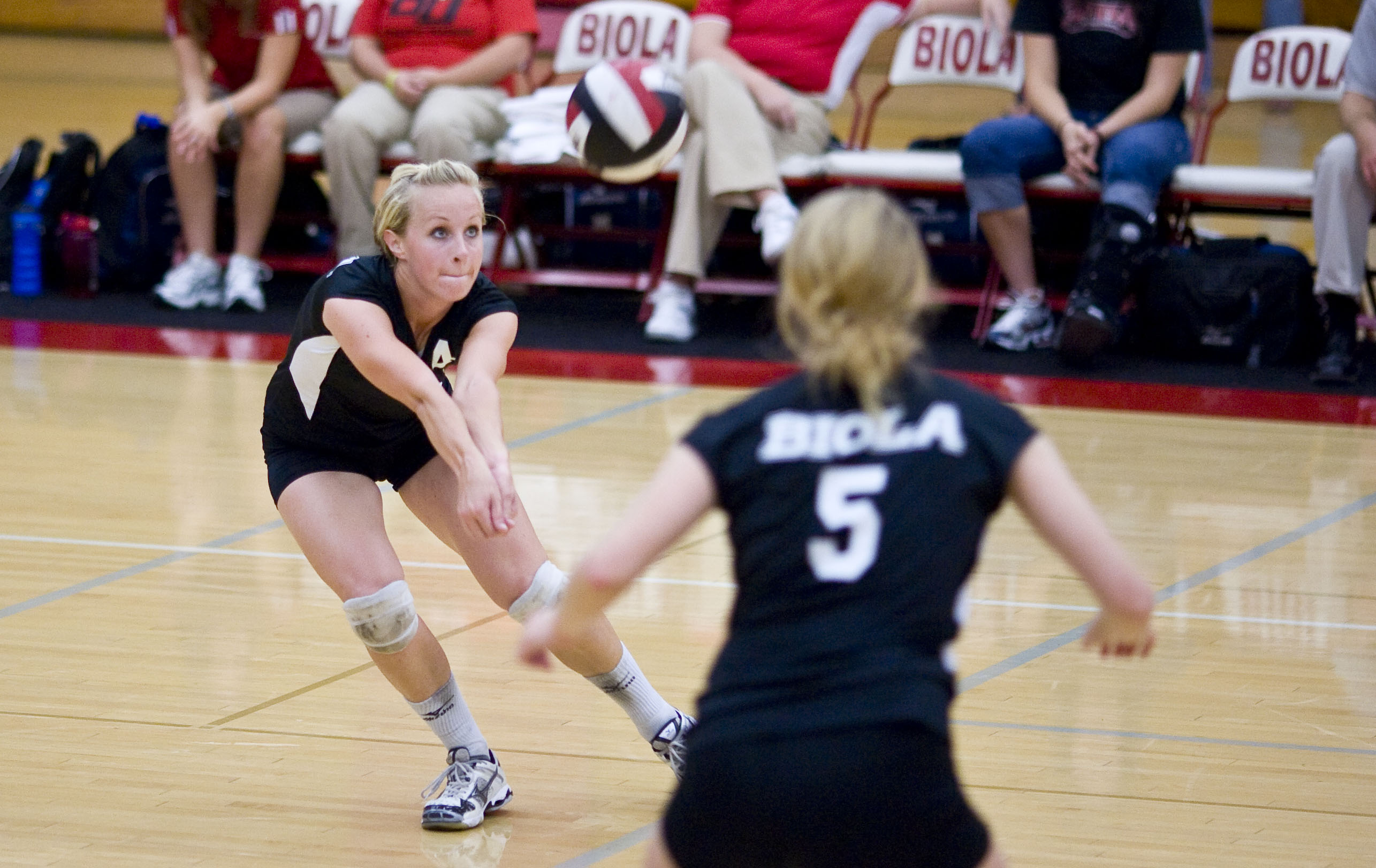 Maggie McGill, senior, returns a serve from Concordia University in Biola's home game on Nov. 1. The Eagles won 3-2.  Photo by Mike Villa