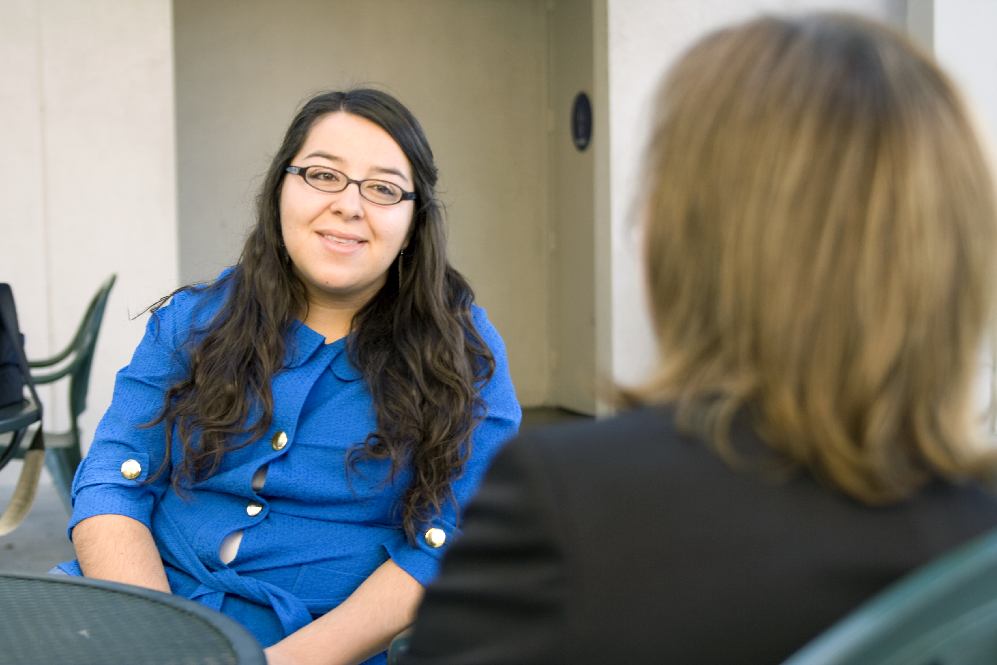 Lorraina Armenta, senior, reconnects with her mentor of two years, Colleen Heykoop, after the semester break.  Photo by Kelsey Heng