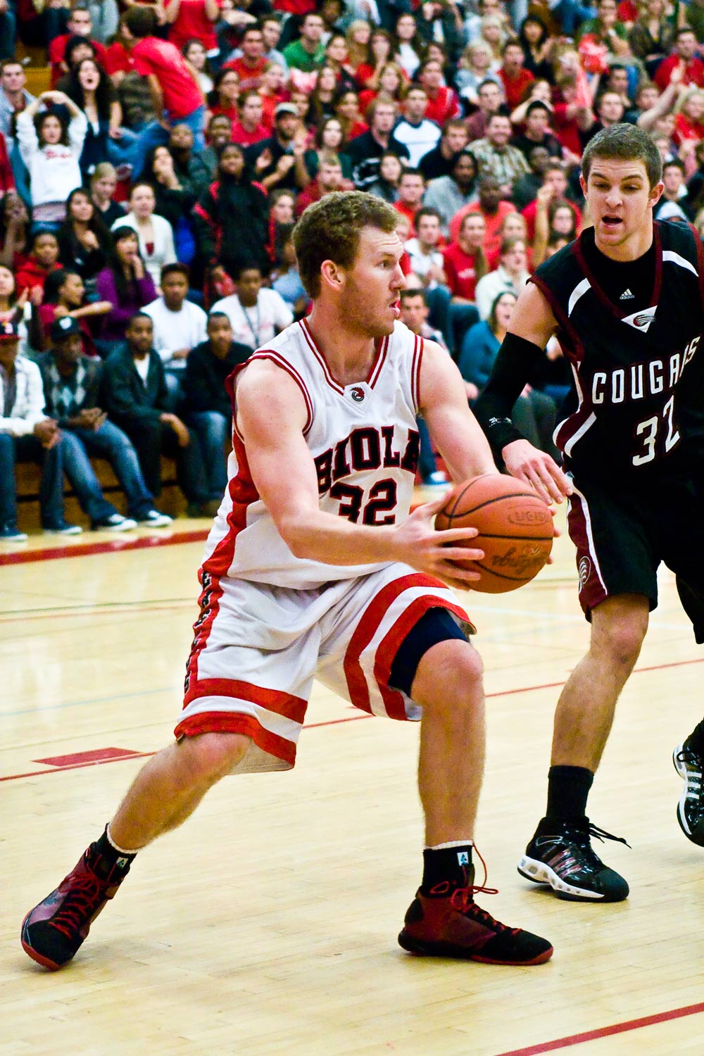 Josh Miller evades an APU defender in Tuesday night's game. Photo by Christina Schantz