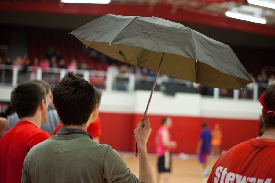 Josh Watson, sophomore and resident of Stewart, showed his dorm pride with an umbrella during the dorm competitions on Thursday, Feb. 5. Photo by Mike Villa