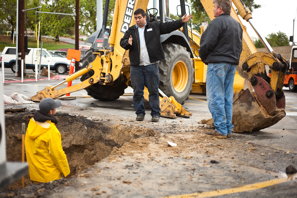 Joseph Valles, a Central Plant Operator, helps contractors from Air Control Systems repair a water pipe that burst outside of Hope Hall February 6, 2009. Photo by Mike Villa