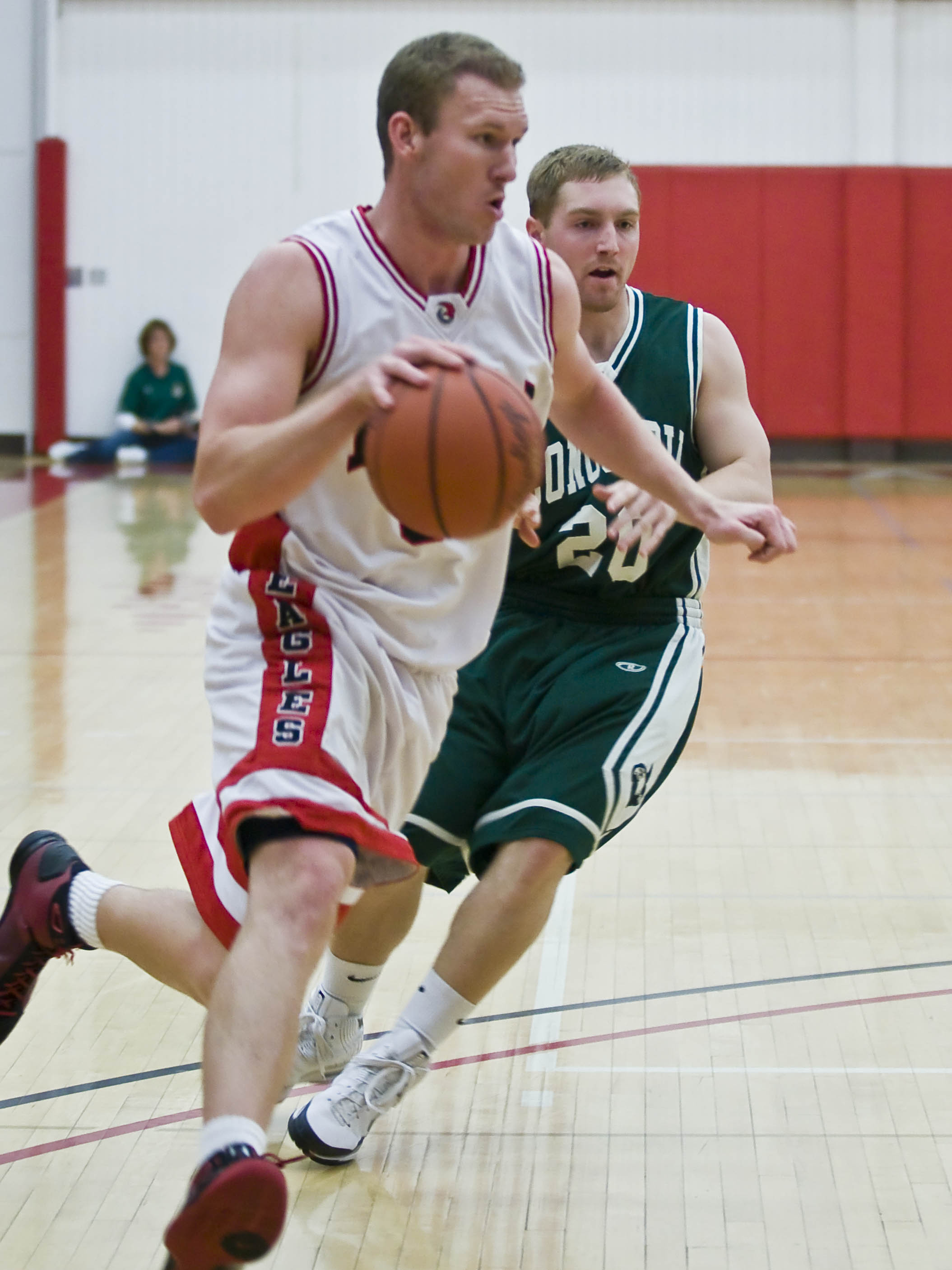 Sophomore forward Josh Miller drives past Concordia's defense in Saturday's homecoming game.  Photo by Christina Schantz