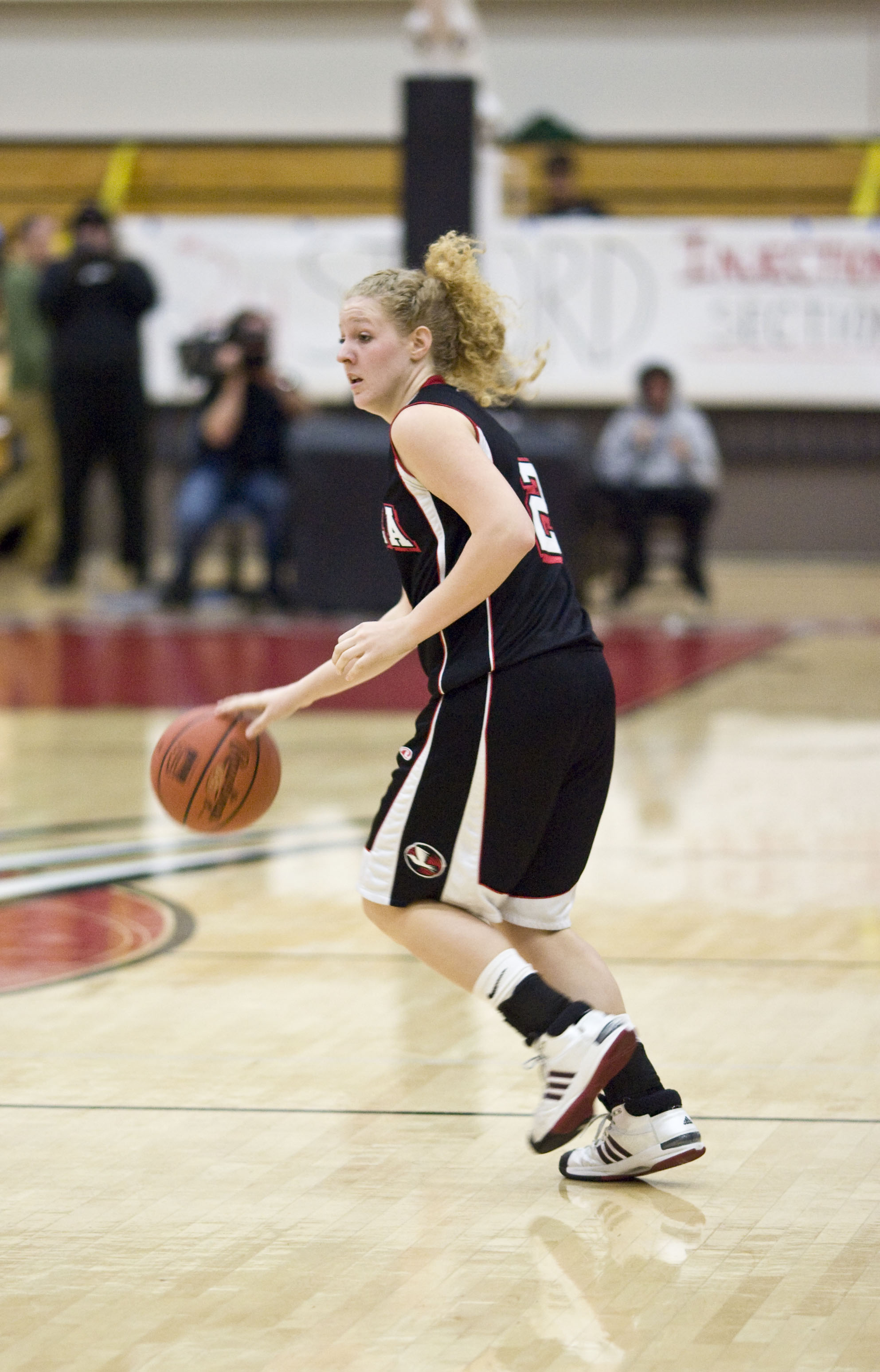 Chelsea De Luca, junior, looks for teammate to pass the ball to in Biola's game against Azusa Pacific on Tuesday, Feb. 10. The Eagles lost to the Cougars 66-68.  Photo by Mike Villa