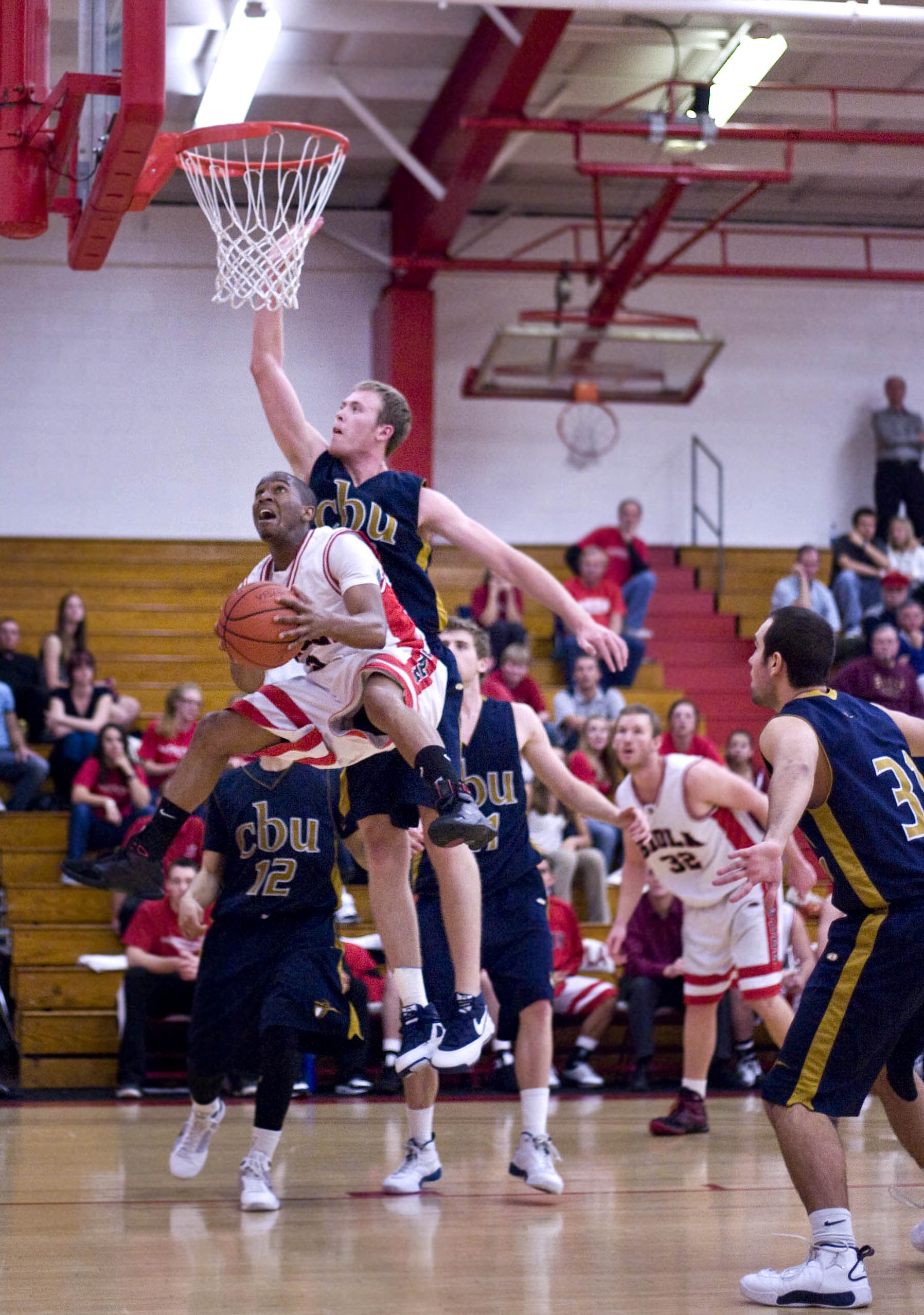 Junior Marlon King jumps to the hoop in Thursday night's playoff game against Cal Baptist. Biola fell 70-80. Photo by Emily Grimsley