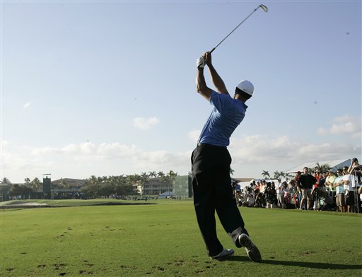 Golfer Tiger Woods tees off on the ninth during a practice round at the CA Championship Wednesday March 11, 2009, in Doral, Fla.  Photo by (AP Photo/Wilfredo Lee)
