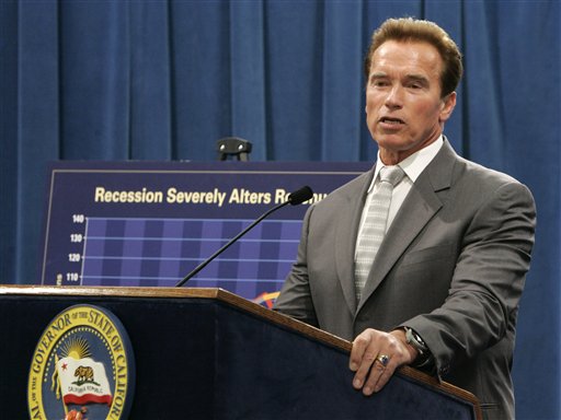 Gov. Arnold Schwarzenegger answers a reporter's question concerning his revised state budget proposal for the coming fiscal year during a Capitol news conference in Sacramento, Calif., Thursday, May 14. Schwarzenegger called for laying off thousands of state employees and slashing billions from education to deal with a projected budget deficit that could go as high as $21.3 billion if voters reject the budget-related measures on next weeks special election ballot. (AP Photo/Rich Pedroncelli)