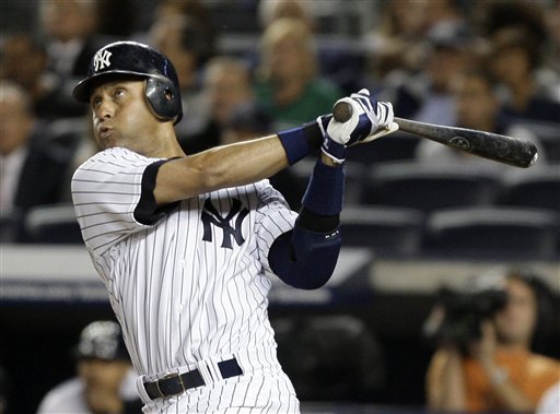 New York Yankees Derek Jeter watches his two-run home run in the third inning of Game 1 of the American League division baseball series against the Minnesota Twins at Yankee Stadium in New York on Wednesday, Oct. 7. (AP Photo/Julie Jacobson)