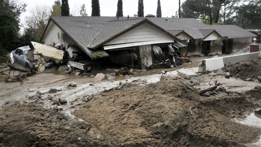 A home is shown damaged by mudslides and flooding on Ocean View Blvd. in La Canada Flintridge, Calif., Saturday, Feb. 6. (AP Photo/Los Angeles Daily News, John McCoy).