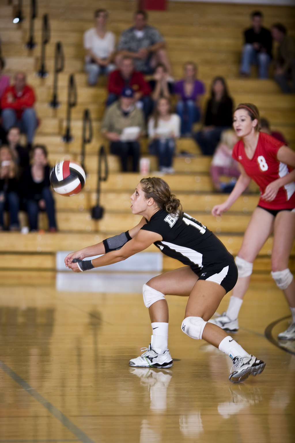 Freshman libero Emily Weingartner digs an early ball against Azusa Pacific. Biola went on to sweep the Cougars in three easy sets. Photo by Mike Villa