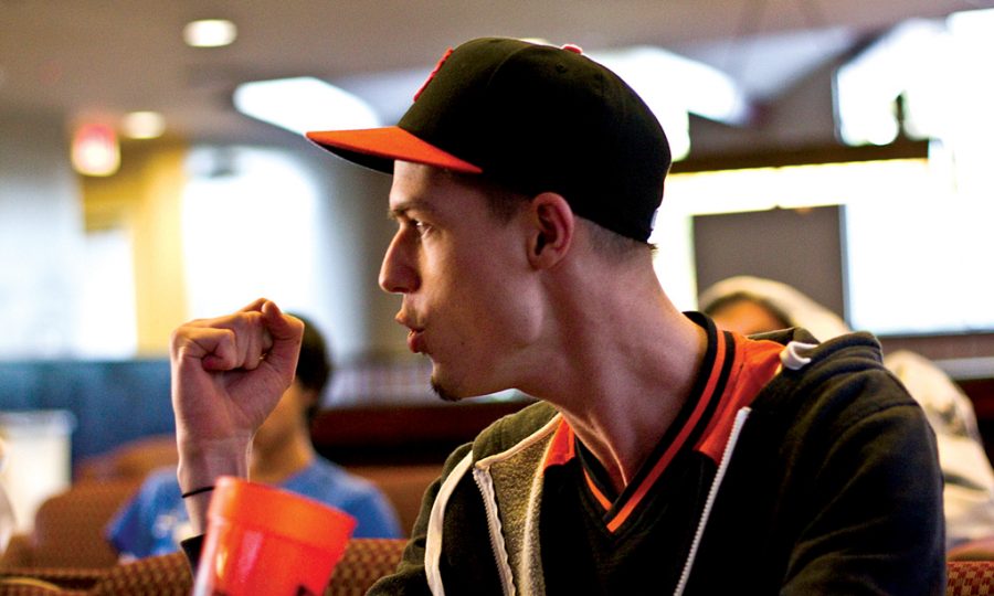 Junior Erik Tveitmoe, Giants fan, celebrates while watching game one of the World Series in the Stewart lobby. The San Francisco Giants went on to defeat the Rangers in the five-game series, using dominant young pitching to shut the Rangers down. Photo by JOB ANG/ The Chimes