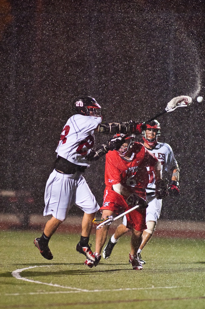 Sophomore Jeff Clark takes a shot against CSU Channel Islands in heavy rain during Friday night's lacrosse game. | Mike Villa/THE CHIMES