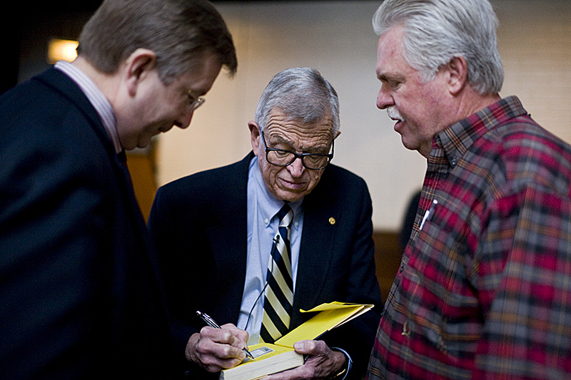 Chuck Colson, author, ethicist, economist, and founder, signs autographs at the Do the Right Thing event on Saturday. Colson was the featured guest and speaker of the event focused on the topics of ethics. |Kelsey Heng/THE CHIMES 