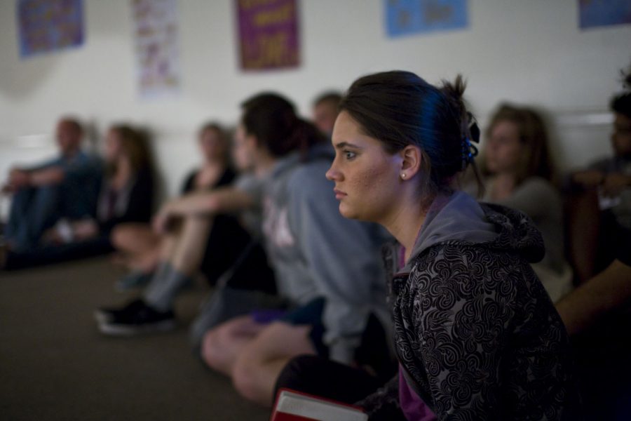 Bethany Linnenkohl watches the skit in the Islam room of Global Awareness on Wednesday, March 16th. Students go room to room experiencing a wide variety of cultures and religions. | Kelsey Heng/THE CHIMES