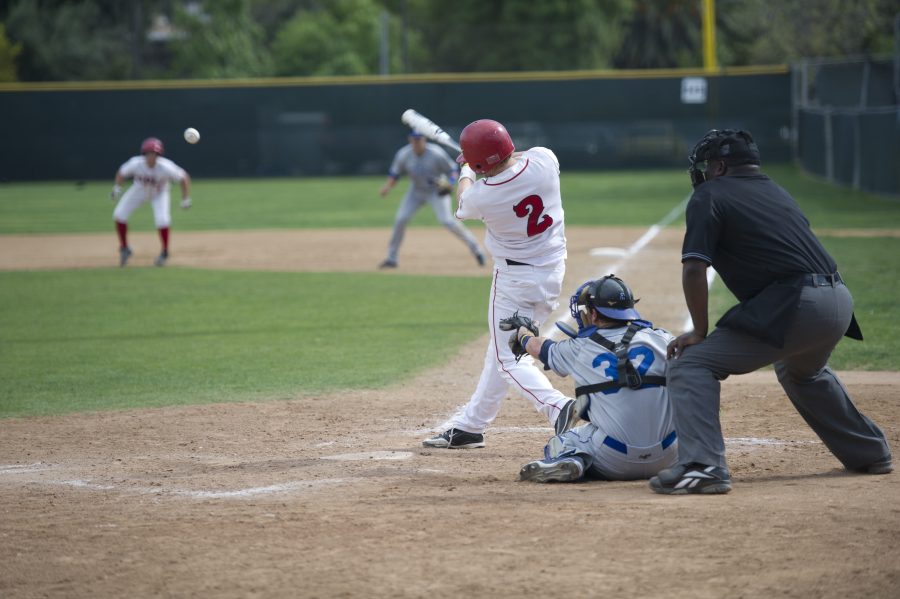 Junior Boone Farrington makes a hit at Biolas home game against Cal State San Marcos on Monday afternoon. | Lauren Kermelis/THE CHIMES
