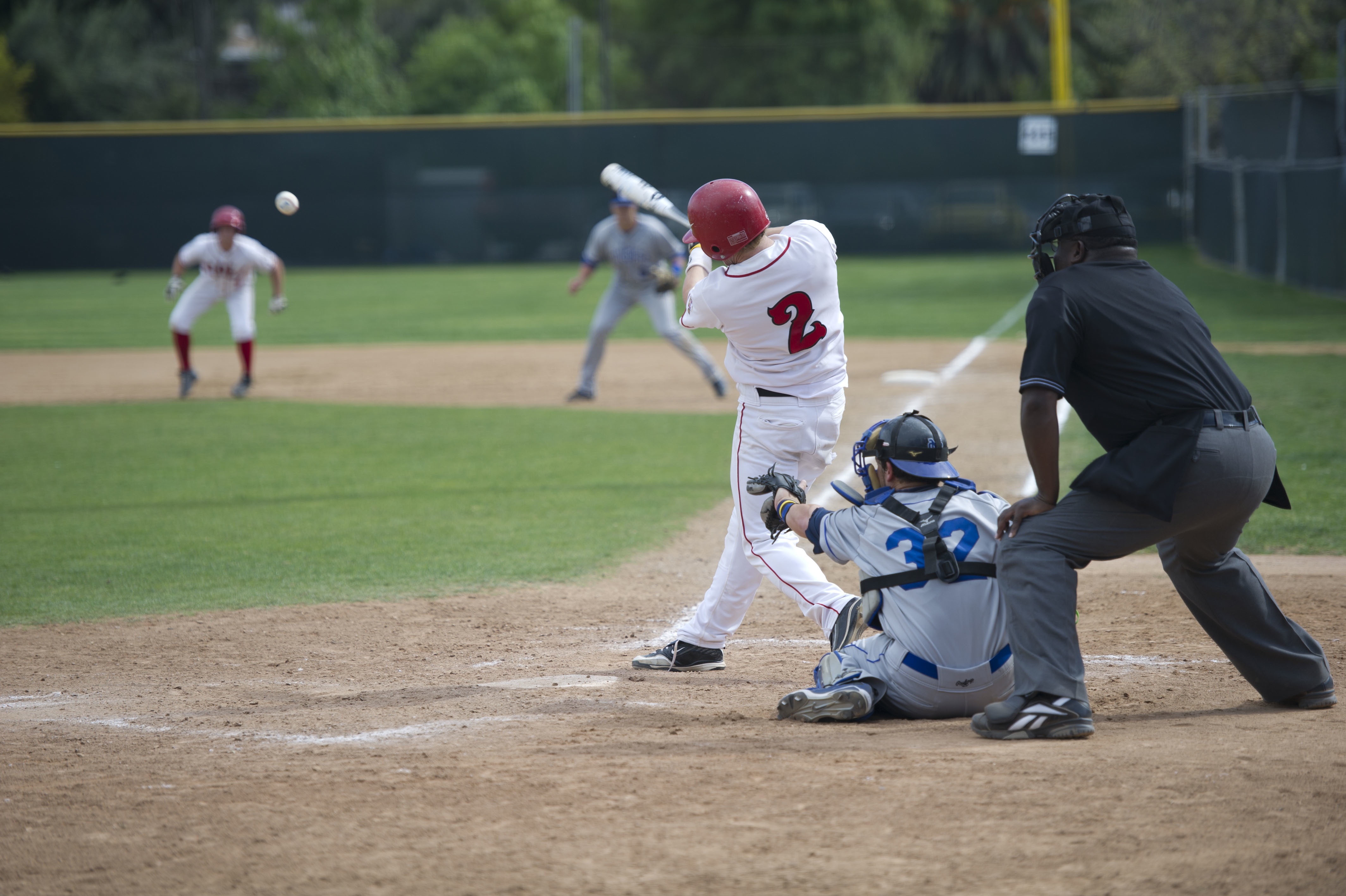 Junior Boone Farrington makes a hit at Biola's home game against Cal State San Marcos on Monday afternoon. | Lauren Kermelis/THE CHIMES
