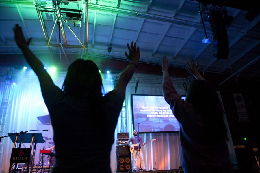Jen Nguyen and Caroline Davoust worship during Friday mornings session of Missions Conference 2011. | Adam Lorona/THE CHIMES