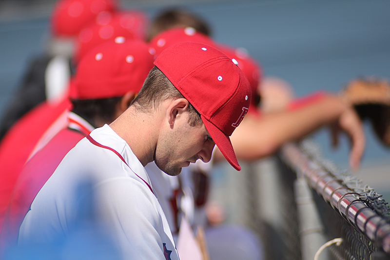 The Biola baseball team is not only a group of talented athletes, but also a visible sign of godly character on and off the field. Prayer is a major part of the team’s routine as God remains the purpose for each player to play every game. | Job Ang/THE CHIMES
