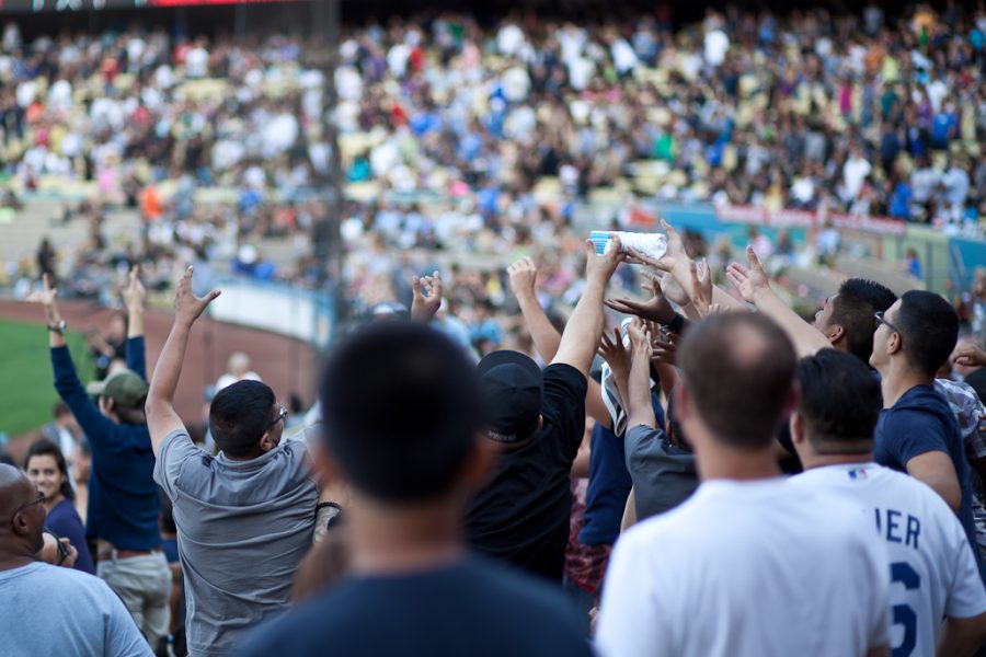 The Audience reaches for a T-Shirt that was shot out into the crowd at the Harvest Crusade on September 10, 2011.| Job Ang/THE CHIMES