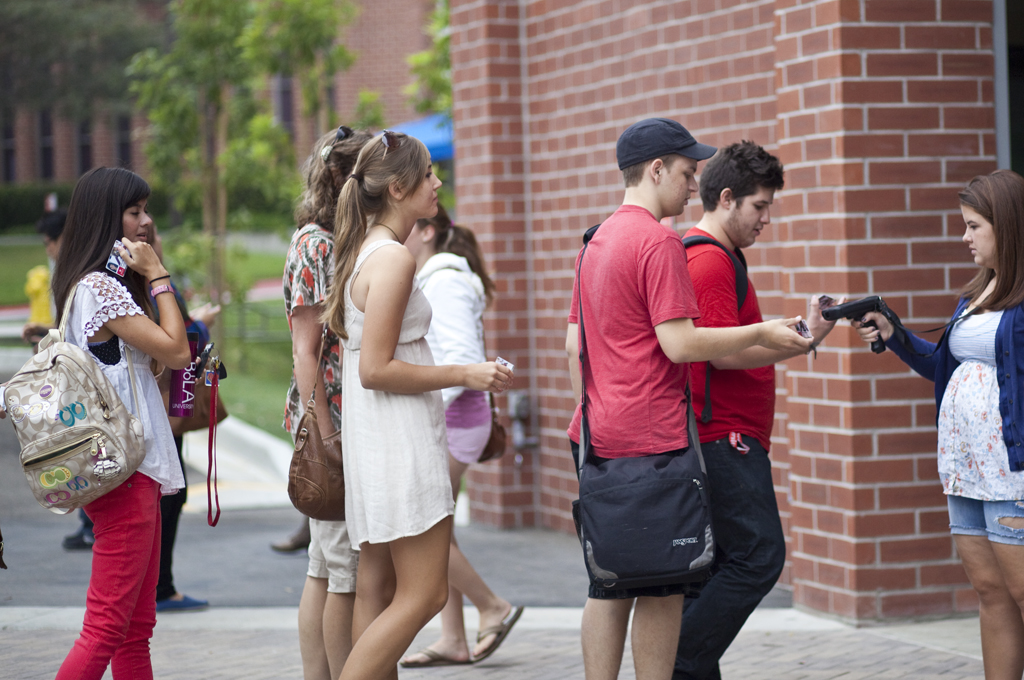 SCANNING IN: Students arrive at chapel on Wednesday morning, Sept. 28. Chapel Board announced on Monday that students who fail to physically attend at least 15 chapels per semester will be fined $375, with the opportunity to attend a one day retreat to reduce the fine. | Job Ang/THE CHIMES