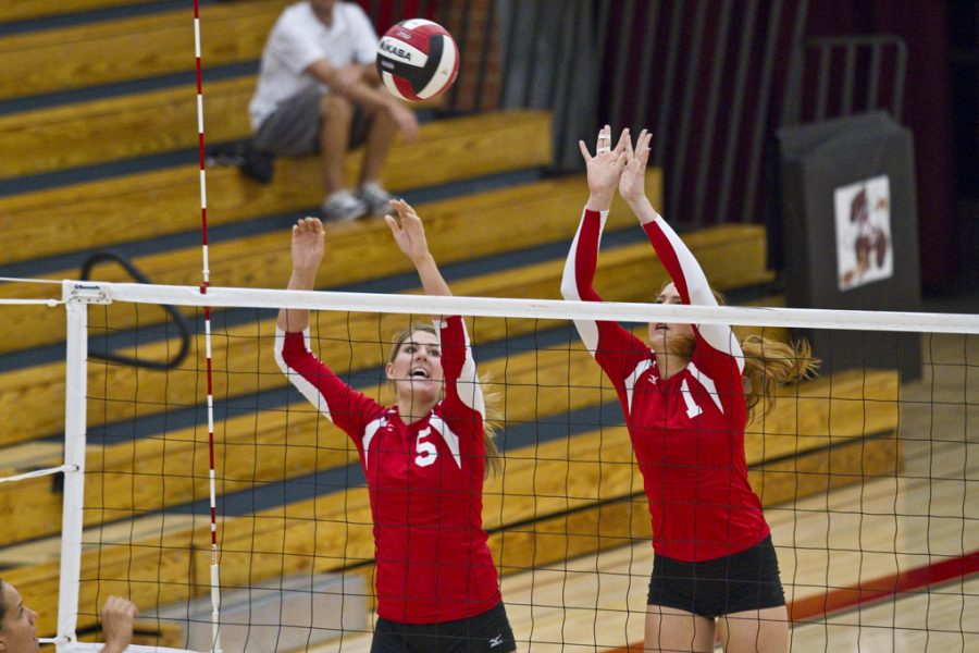Junior Rachel Buckley and sophomore Chelsea Amits go up for a block. They played against Vanguard on September 15, 2011 winning three sets at 25-19, 33-21,and 25-16. | Tyler Otte/THE CHIMES