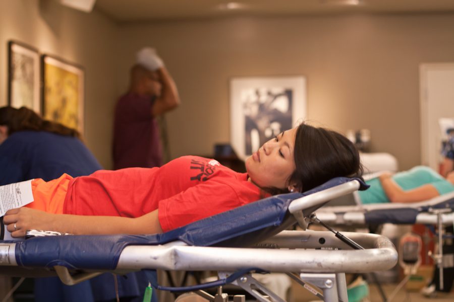 Sophomore Ari Watkins gives blood at the blood drive on September 13, 2011. | Katie Juranek/THE CHIMES