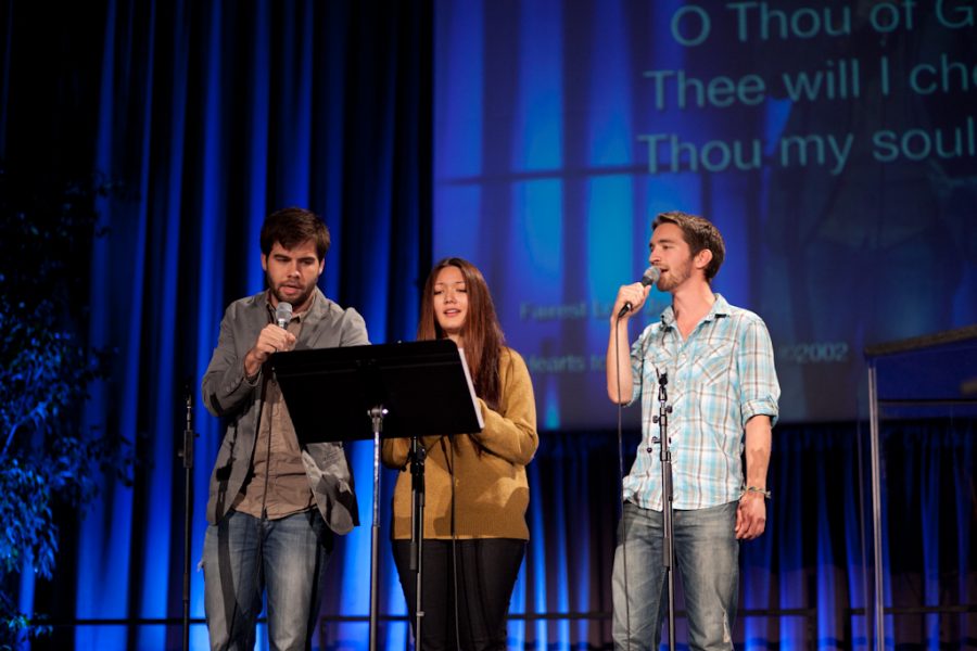 Mackenzie Burns, Pearl Botts, and Caleb Parker sing acapella worship to open session five on October 20, 2011. | Job Ang/THE CHIMES 