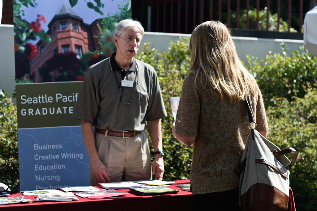 Biola junior Lexi Hunt listens to a Seattle Pacific staff member about their Graduate Program at the Biola Grad Fair on October 11, 2011. | Emily Arnold/THE CHIMES