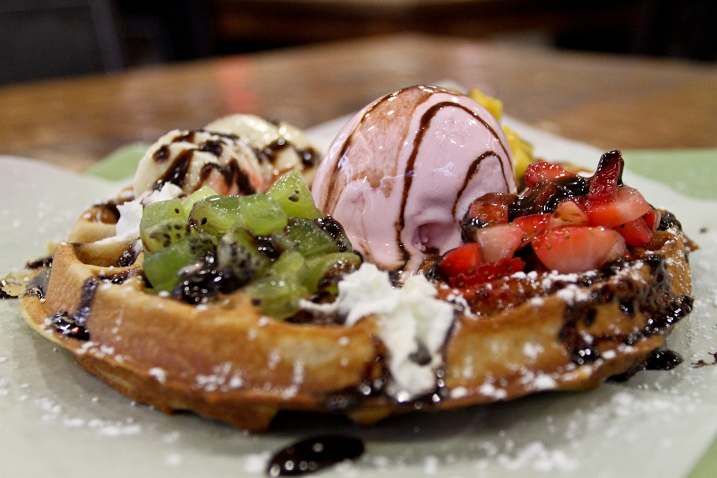 The strawberry and banana waffle comes with fresh fruit and strawberry gelato on top. | Tyler Otte/THE CHIMES