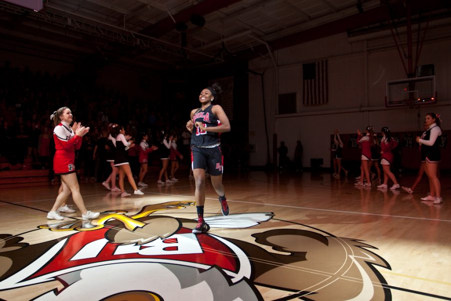 The womens basketball team rushed to the floor for their debut during Midnight Madness 2011. | Tyler Otte/THE CHIMES